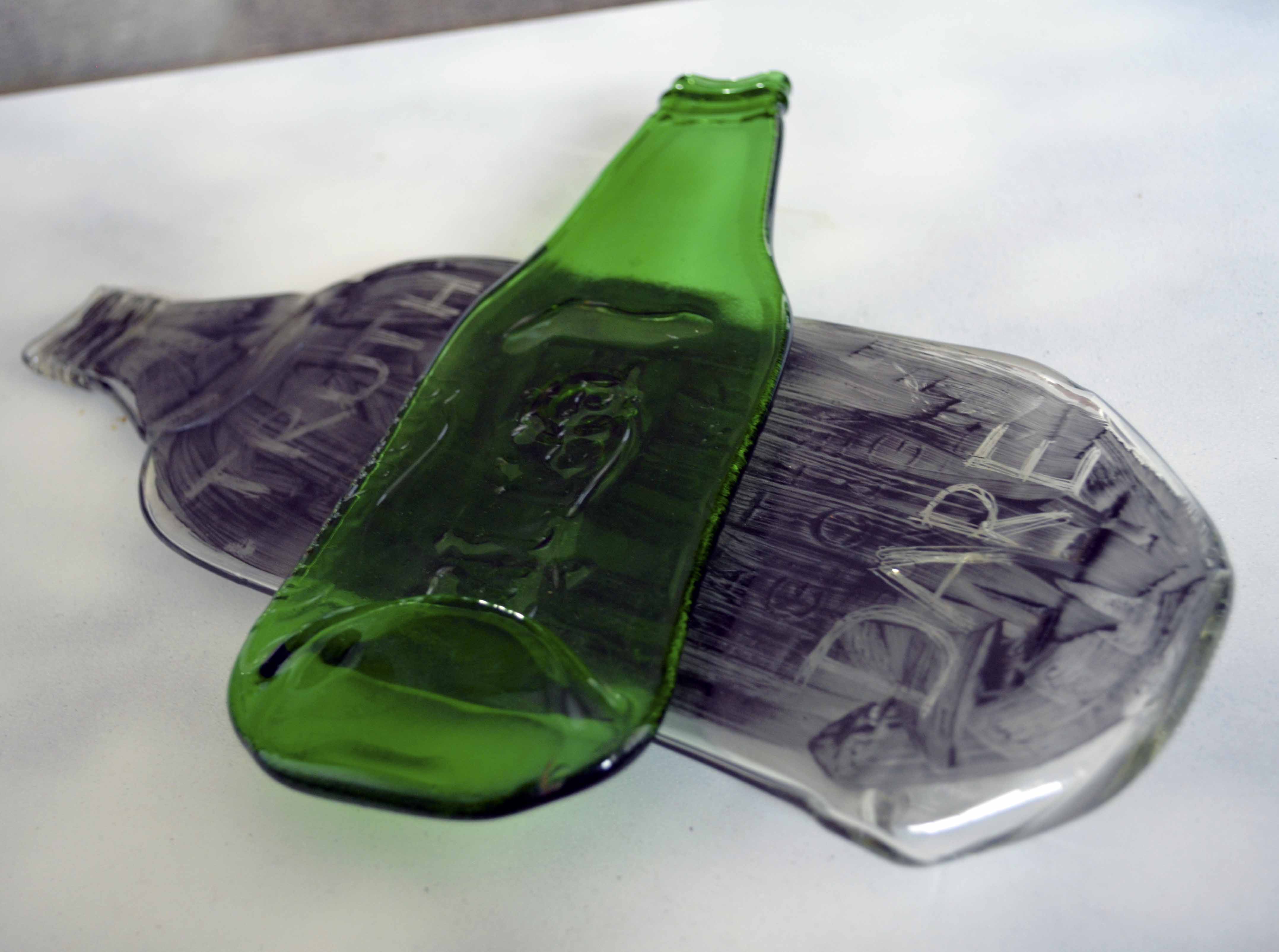 Kiln-formed, up-cycled bottles.