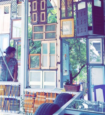 ekta at the upcycled window wall at the WonkyStudio